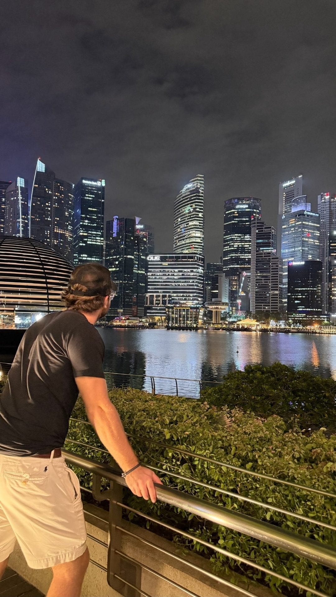 Melker Pasternak Ivarsson at night, overlooking the Singapore skyline across Marina Bay